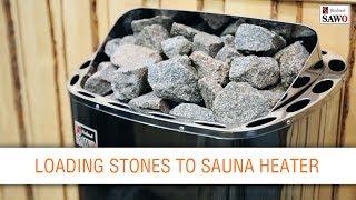 Loading stones to sauna heater