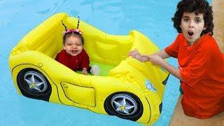 Sami and amira play with inflatable cars