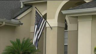 Retired police officer facing HOA fines over thin blue line flag