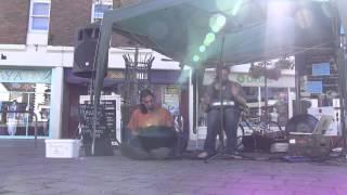 Passing hippie with mini Handpan with Torbz Glastonbury Fringe Festival 2015