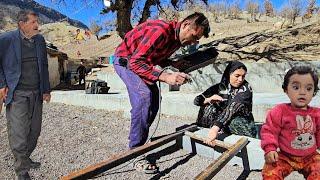 Village family. Babak building a fence for the villagers 