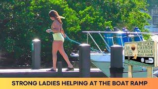 STRONG LADIES HELPING AT THE BOAT RAMP