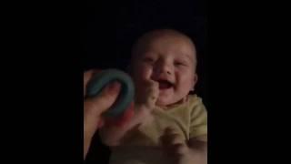 Baby laughing at nose sucker