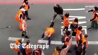 Just Stop Oil protester thrown to ground by enraged motorist