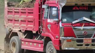 Dump Trucks Spreading Building Road