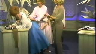 Dody Goodman Demonstrates a Girdle for Dinah Shore and Olivia Newton-John
