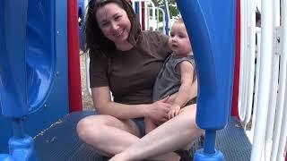 Paige and Misha go down slides