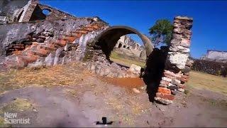 Drone-racing pilot navigates through abandoned buildings