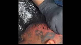 #BlueFace gets his tattoo Artist name on his head  he had to pay em for some unpaid jewelry