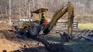 Moving Backhoe Across Trench