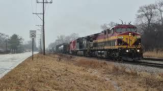 KCSM/NS AC44s, CP SD40-3 on CPKC 2-246 in pouring rain at Morton Grove