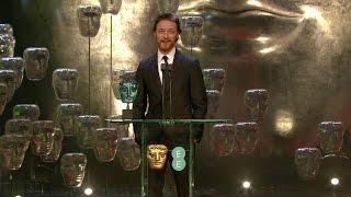 James McAvoy presenting Jack O'Connell The EE Rising Star Award at BAFTA 2015