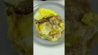 Frying a BALUT egg (fertilized duck)