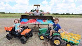 Filling our tractors with TONS of water balloons | Tractors for kids