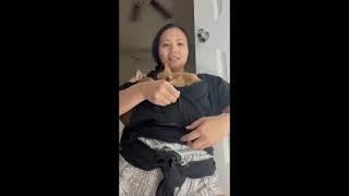 Woman tries to fit multiple puppies in a sling carrier!