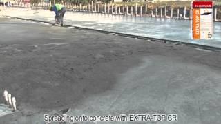 Broadcasting EXTRA-TOP CR onto fresh concrete by ISOMAT S.A.