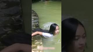 Cute girl Bathing with wet dress