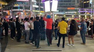 Indians dance at the Eaton Centre, Dundas Square, Toronto, Ontario, Canada