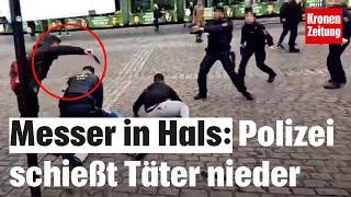 Bei rechter Kundgebung: Messer in Hals: Polizist stoppt Täter mit Schüssen | krone.tv NEWS