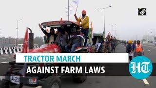 Watch: Protesting farmers held tractor march at Delhi borders