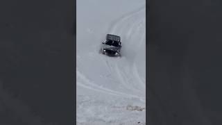 Jeep Cherokee in deep snow