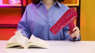 A young woman dries her hair with an electric hair dryer. | Free Stock Footage