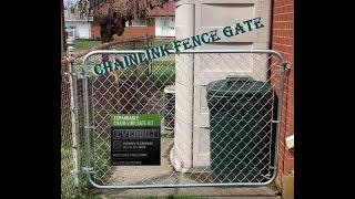 Chain link fence gate assembly