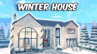 BUILDING A WINTER HOUSE in BLOXBURG | speedbuild