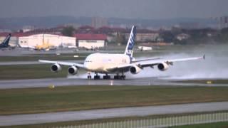 Airbus A380 performing touch-and-go on a wet runway