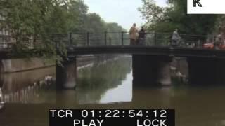 1970s Amsterdam, Netherlands - People Cycling Across Canal Bridge, Bicycles