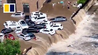 Vehicles washed away by floods as heavy downpours hit China