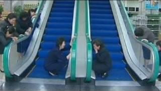 Mourners weep at escalator used by Kim Jong-il