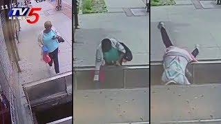 Woman Distracted by Mobile Phone Falls into Open Sidewalk Doors | TV5 News