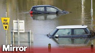 Heavy rain causes flood warnings and disruption around UK