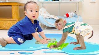 Monkey Pupu helps Nguyen clean the floor when he spills water