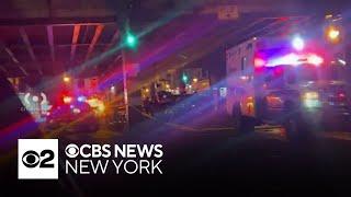 Two killed as car crashes into elevated subway column