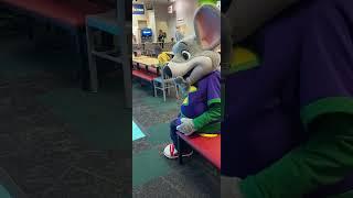 Chuck E Cheese sits on a Whoopee cushion 