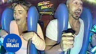 Hilarious reaction of couple on a slingshot ride - Daily Mail