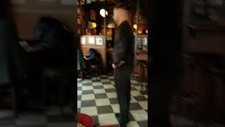 Bar Fight - Irish Pub Confrontation - Bartender Faces Off with Unruly Patron - Caught on Camera