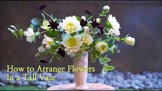 how to arrange flowers in a tall vase