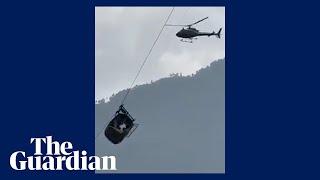 Children trapped in chairlift hanging 900ft above ravine in Pakistan