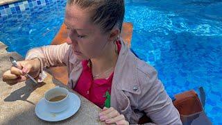 Trailer video. Pink Polo shirt, jeans skirt, jacket. Coffee in the pool