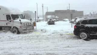 Volkswagen Touareg TDI pulls transport truck out of snow bank