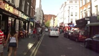 Walking down Old Compton Street, Soho, London, UK; 20th August 2012