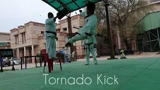 Sensei Aman doing a Flying side kick over 5 students.