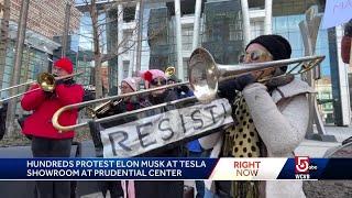 Demonstrators protest Elon Musk at Boston Tesla dealership