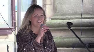 Laura Turner sings at Macclesfield Treacle Market with Dean Richards on acoustic guitar.