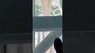 In the top of Dubai frame , walking on transparent Glass . Really interesting  -