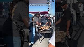 Rasheed Philips from American Barbecue Showdown making smoked jerk chicken at “Smoking Out The Hub”