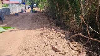 Building a farm wall in Thailand concrete blocks.